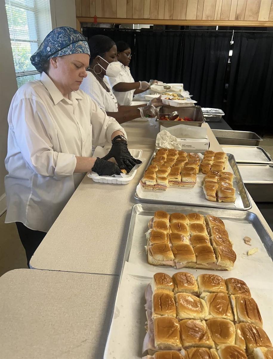 Team preparing sandwiches for an event