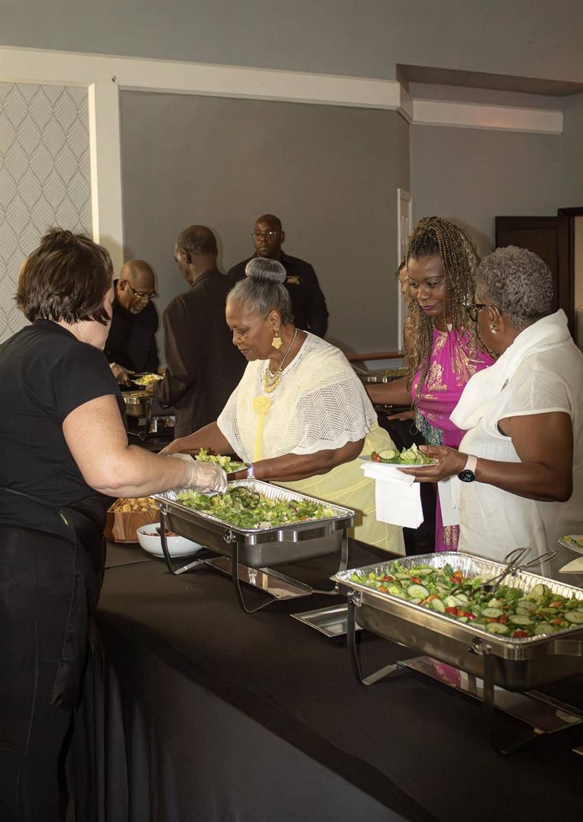 Guests serving themselves at a catered event