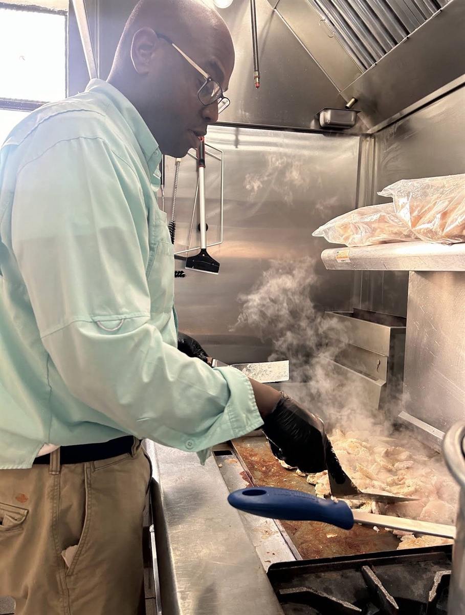 Chef cooking over steam in the kitchen